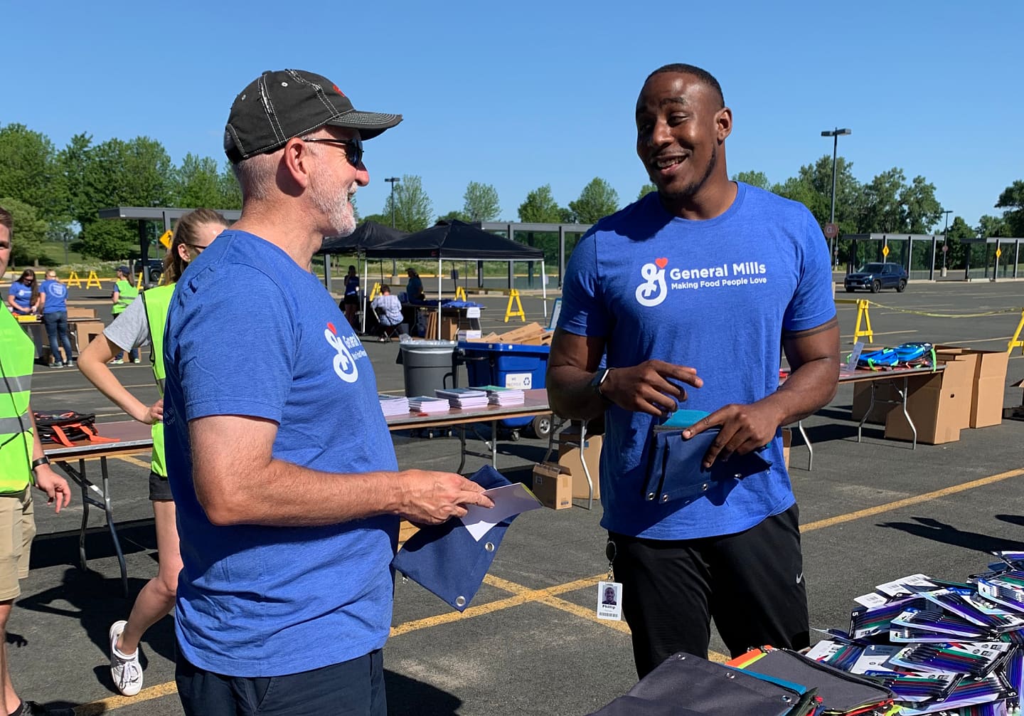 CEO Jeff Harmening talking to employee at WHQ Day of Courageous Action